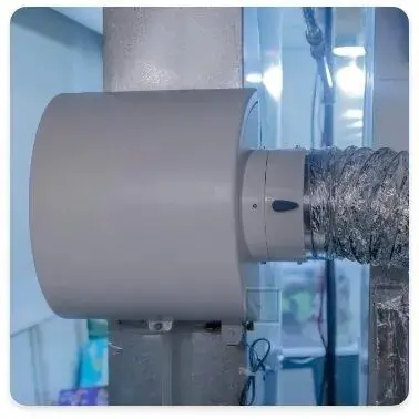 A humidifier unit is attached to ductwork in a home